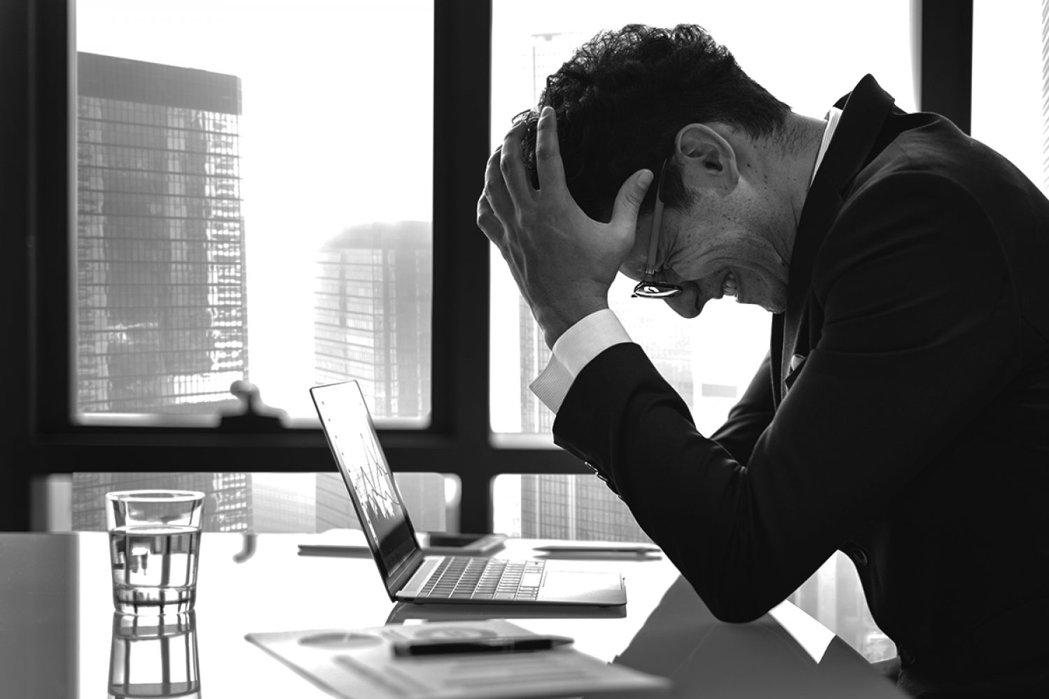 Stressed young businessman overworking